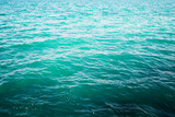 Shining blue water ripple background. Tropical backdrop.