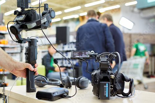 Behind the scenes of video production or video shooting. The concept of production of video content for TV, blog, shows, movies. Cameras prepared for video filming