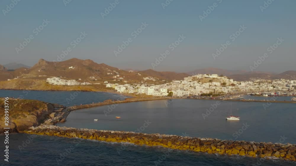 Aerial flight towards the town of Naxos over the harbour in Greece Aerial flight towards the town of Naxos over the harbour in Greece