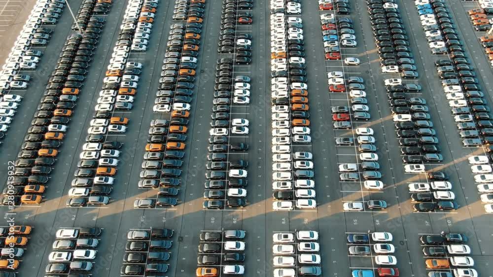 different car rows parked on finished auto warehouse area different car rows parked on finished auto warehouse area