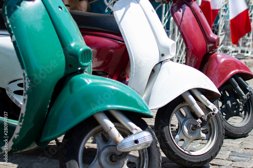 Red, green and white scooters symbolize the prapor of Italy, close-up of transport photo