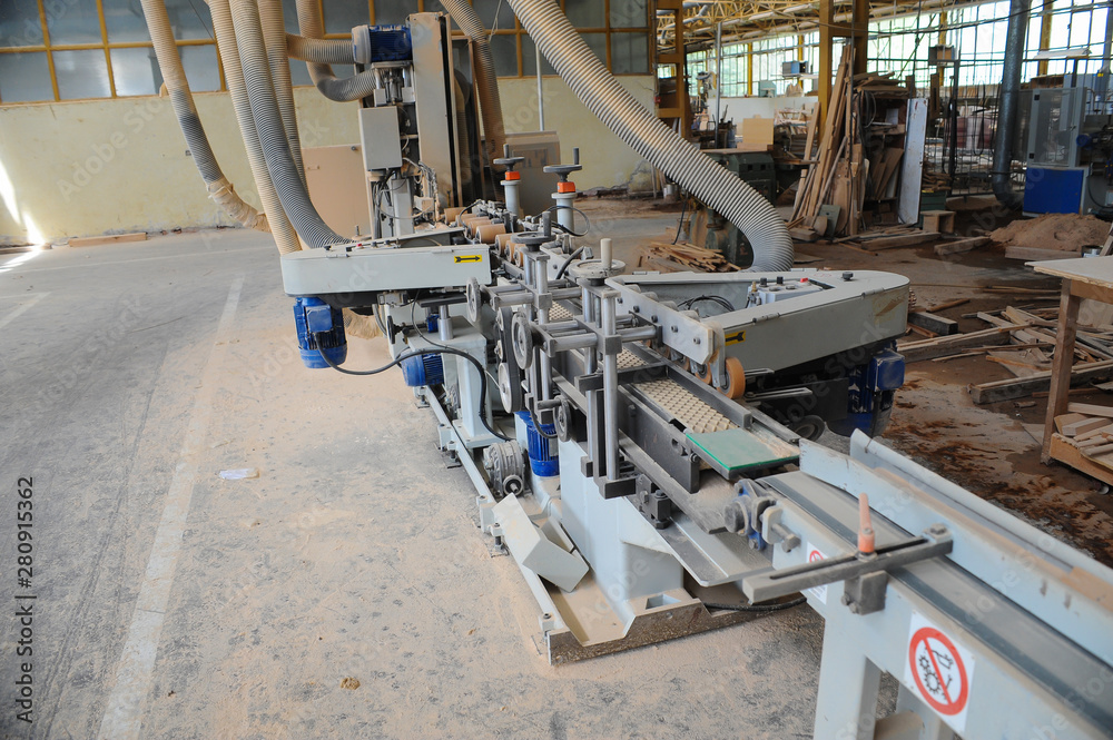 Wood processing machines and pieces of products in a furniture factory