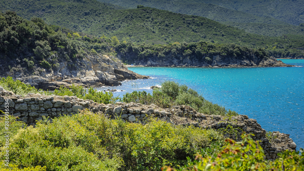 Beautiful sea bays on the Greek peninsula Halkidiki. Blue water and high green forests
