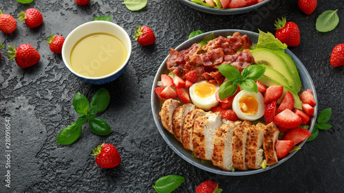 Chicken Cobb salad with strawberries, bacon, avocado and boiled eggs