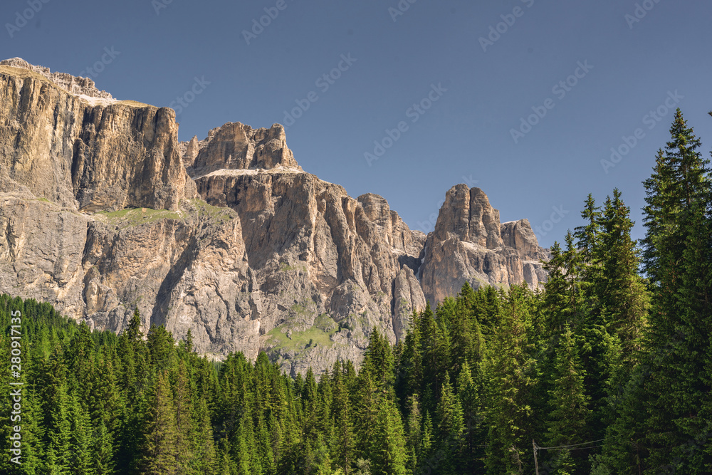 Idyllic Alps with high rocky mountain and forest