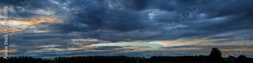 Panorama of the sky with beautiful colored whimsical clouds © Elena