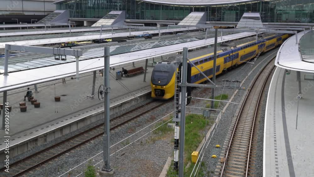 Double Decker Train arrives at the new Utrecht Central train station at the end of the day, Utrecht, The Netherlands, July 12th 2019