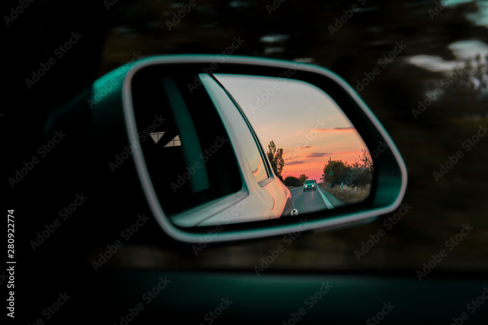 Car on the road during sunset