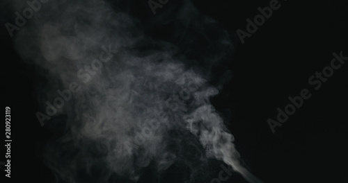 water vapor stream comes from below over black background with motion blur