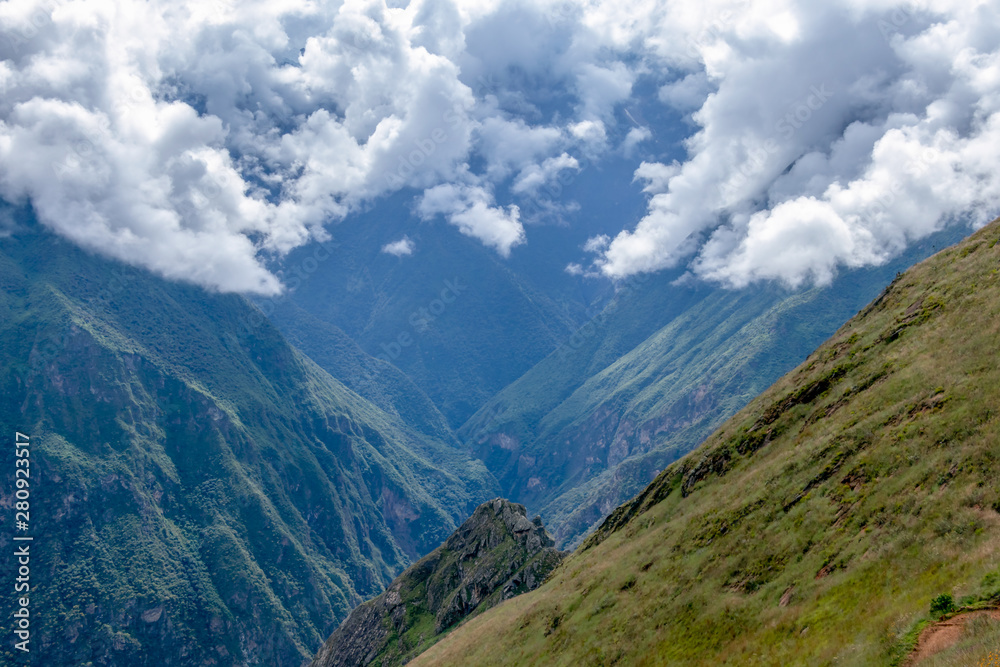 Blurred background with the cloud-covered mountain peaks of Apurimac river valley, Peru