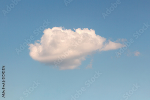 Lonely white cloud on blue sky. Abstract nature background