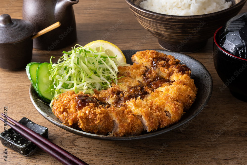 Tonkatsu or deep fried pork, a traditional Japanese dish. Tonkatsu or deep fried pork, a traditional Japanese dish.