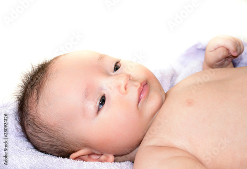 Bathed little baby, baby lying on towel with isolated white background