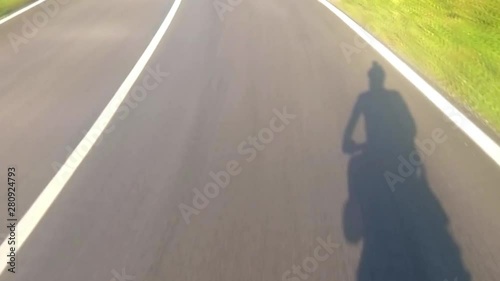 A man riding on a bike at the road highway photo