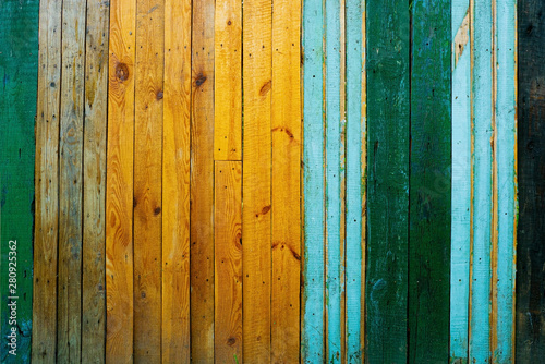 Abstract vintage colorful wooden fence background. photo