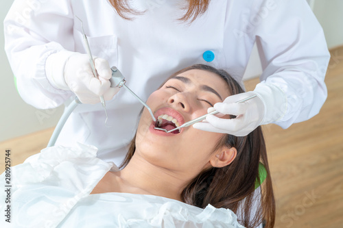 Portrait of a dentist being positive about oral health of patient
