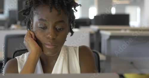 Bored Young Black Woman at Job