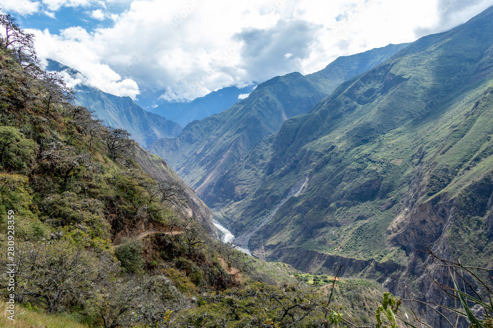 The Apurimac river valley: Green steep slopes of deep canyon with lush vegetation, the Choquequirao trek, Peru