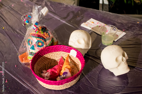 Sugar Skulls Decorating Class Props with a Finished Colorful Skull for the Day of the Dead Holiday in San Diego, California, USA