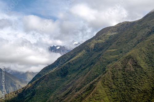 Morning landscape with Peruvian Andes mountains peaks covered with clouds at sunrise