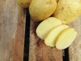 Potatoes on wooden table