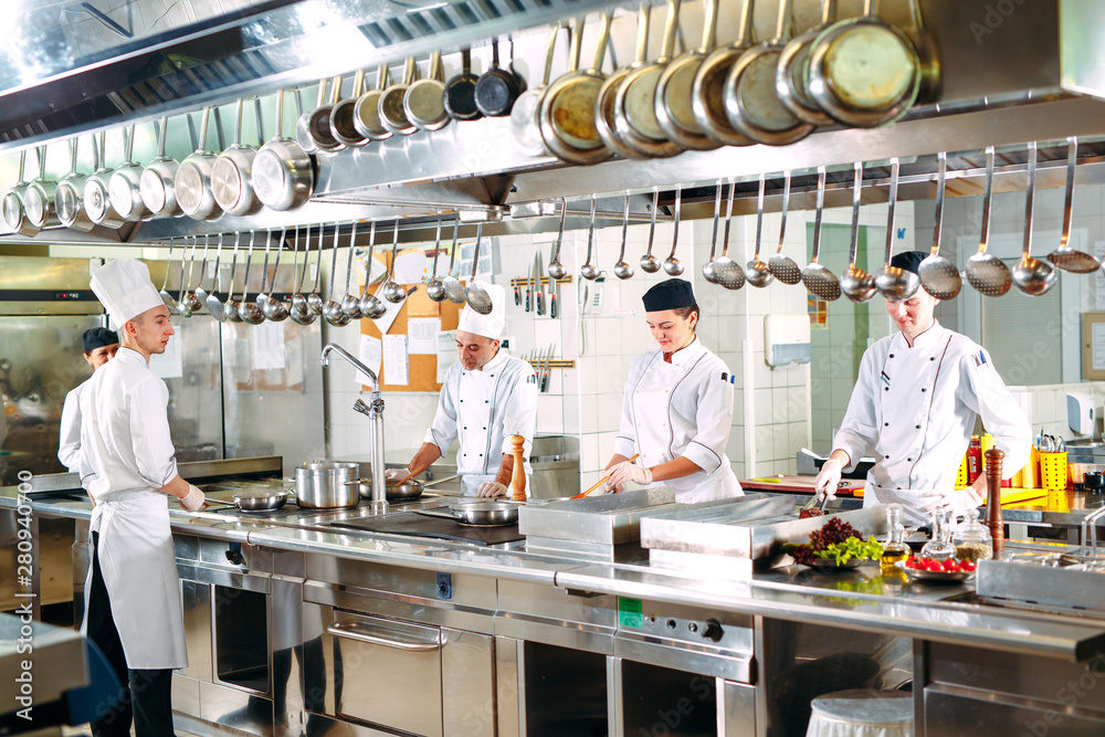 Modern kitchen. The chefs prepare meals in the restaurant's kitchen. Modern kitchen. The chefs prepare meals in the restaurant's kitchen.