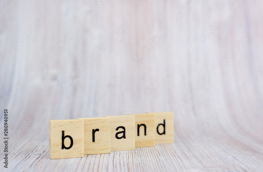 Wooden cubes with word brand on wooden table. Brand building for success concept Wooden cubes with word brand on wooden table. Brand building for success concept