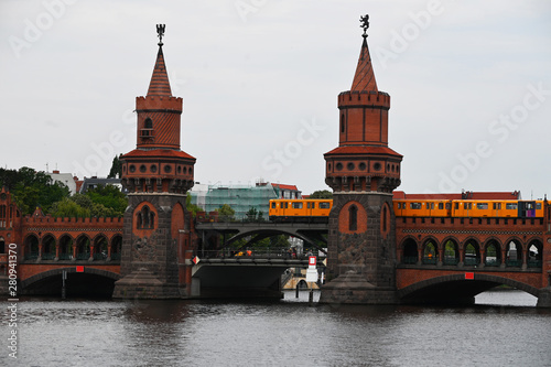 the oberbaumb bridge in Berlin with the passage of the railway train