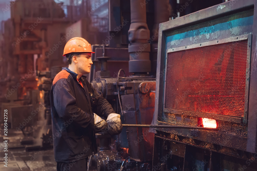 Workers in the steel mill.