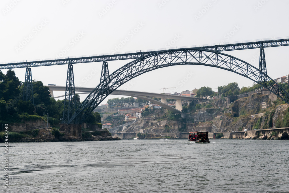 Fototapeta premium The Maria Pia Bridge (Ponte de D. Maria Pia), railway bridge over the Douro River in Porto, Portugal