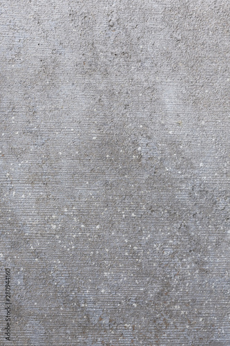 modern grey concrete texture / background with soft gradient and white inclusions 