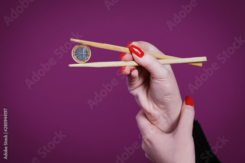 Coin with chopsticks