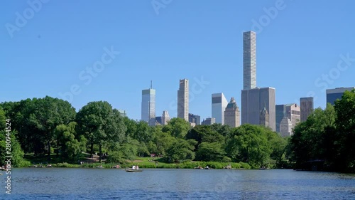 New York, United States, June 12, 2018: Tourists rowing in multiple boats at The Lake in Central Park in the heart of New York City