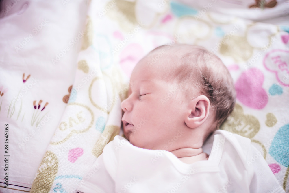 cute newborn baby sleeping peacefully in the crib. cute newborn baby sleeping peacefully in the crib.