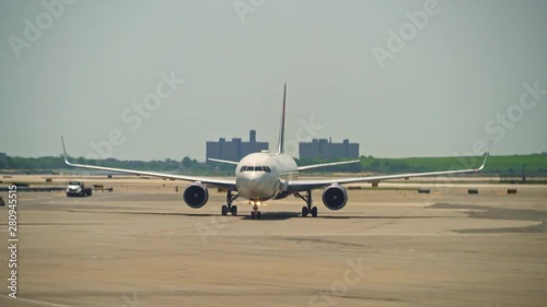 New York, United States, June 10, 2018: Big passenger plain driving towards the gate at a large international airport