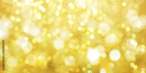 Gold Glitter defocused bokeh lights background for decoration concept and xmas holiday festival backdrop