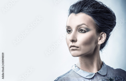 portrait of fashionable woman with stylish hair and evening makeup photo