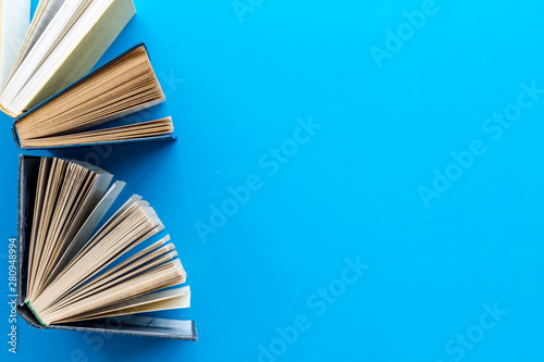 workplace with books on blue background flatlay mockup