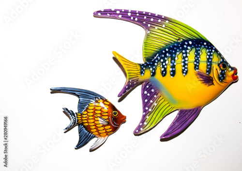 Toy fishes on white background