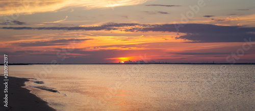 Fototapeta Naklejka Na Ścianę i Meble -  Watching an amazing sunset in Florida's panhandle