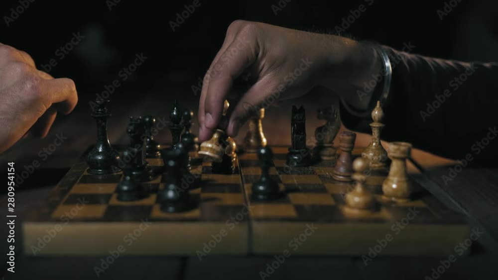 Close-up, Two Men Play Chess Game At Night Close-up, Two Men Play Chess Game At Night