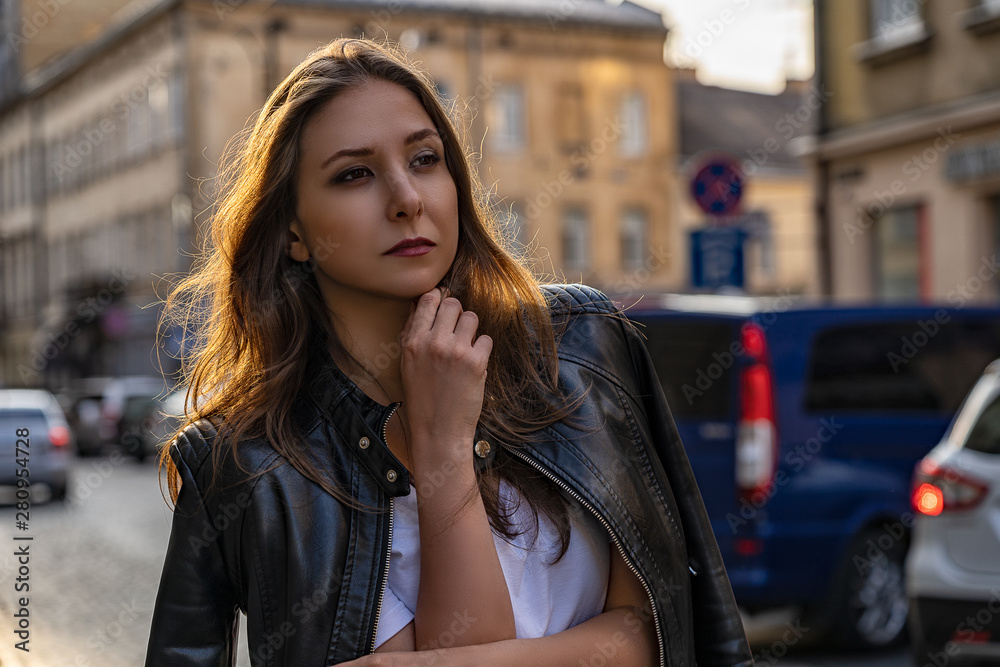 Portrait of the girl in black leather jacket on the street of Lviv city