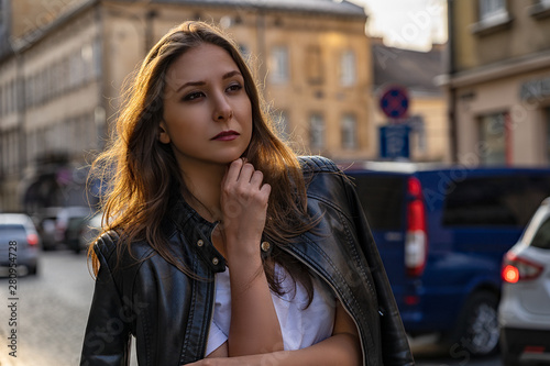 Portrait of the girl in black leather jacket on the street of Lviv city