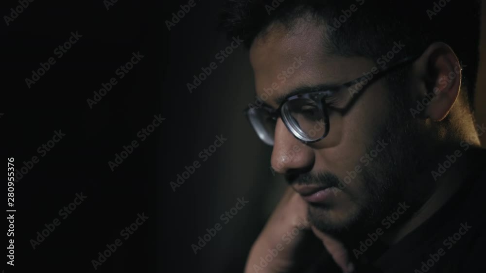 Close-up, Indian Man in Glasses Pensively Looks at the Chess Board, Ponders the Combination in the Game Close-up, Indian Man in Glasses Pensively Looks at the Chess Board, Ponders the Combination in the Game