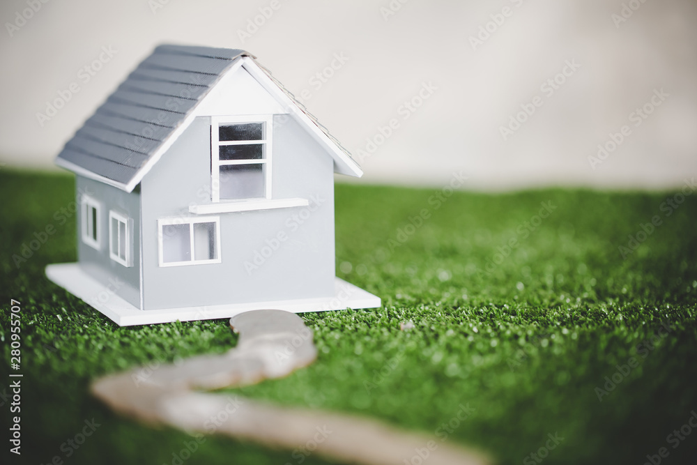 money coins and home model, the saving with growing your money to real estate owner in the future concept. money coins and home model, the saving with growing your money to real estate owner in the future concept.