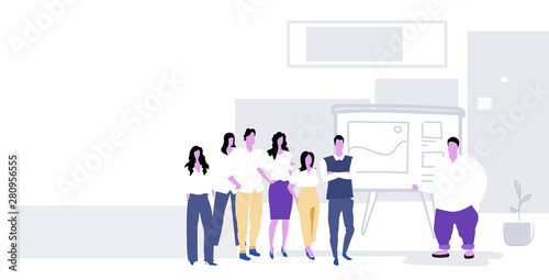 fat overweight man speaker presenting financial report on flip chart businesspeople group training conference meeting presentation concept office interior sketch full length horizontal