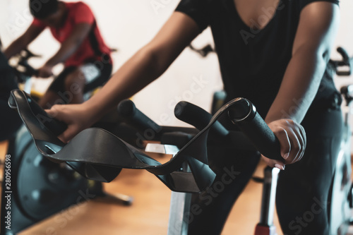 Fit people working out at spinning class in gym © Gayan