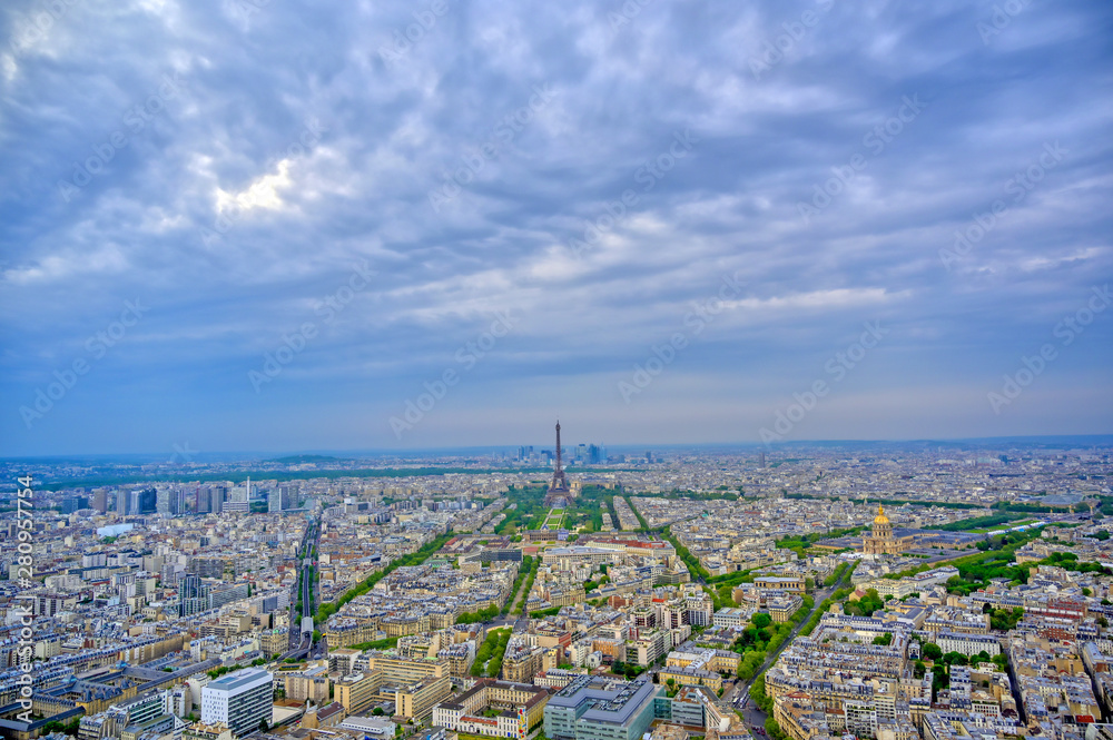 An aerial view of the Eiffel Tower and Paris, France at dusk..