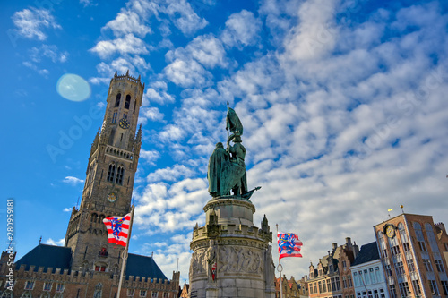 The Jan Breydel and Pieter de Coninck statue located in the historical city center and Market Square (Markt) in Bruges (Brugge), Belgium on a sunny day. photo