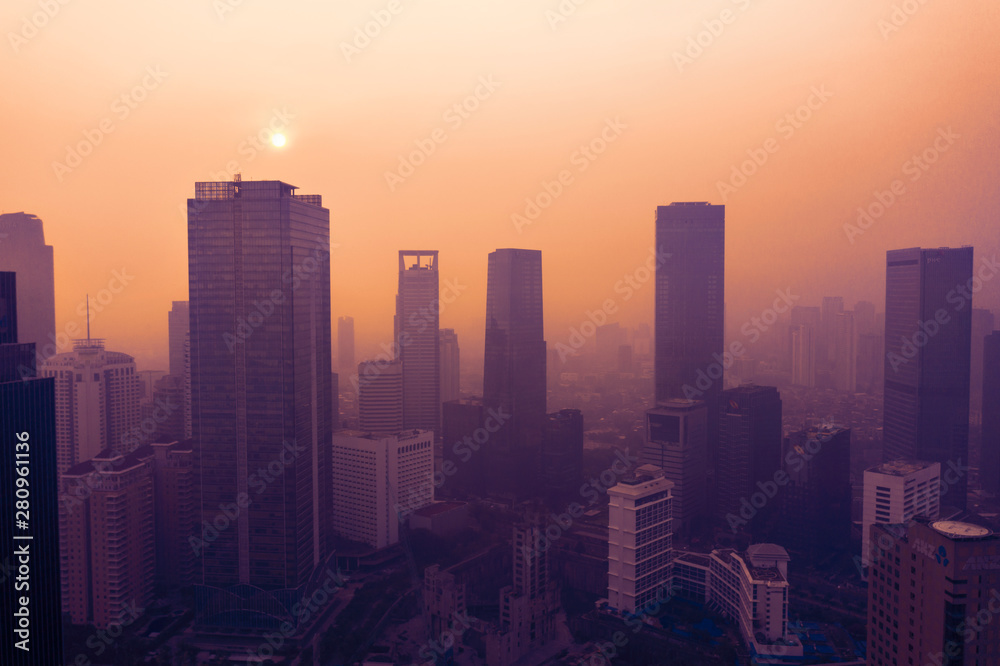 Silhouette of skyscrapers with air pollution